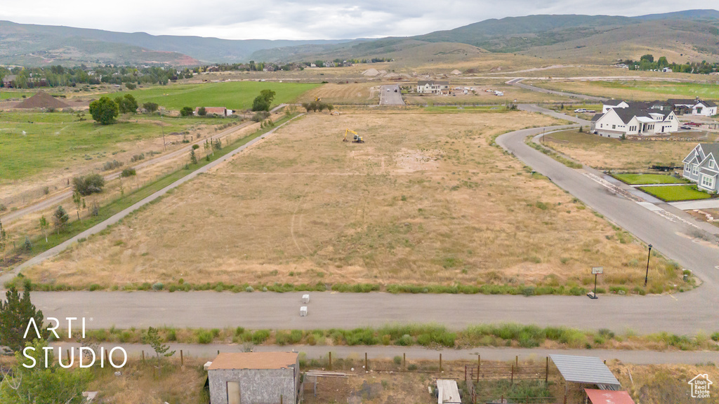 Overview of rural landscape with a mountain backdrop