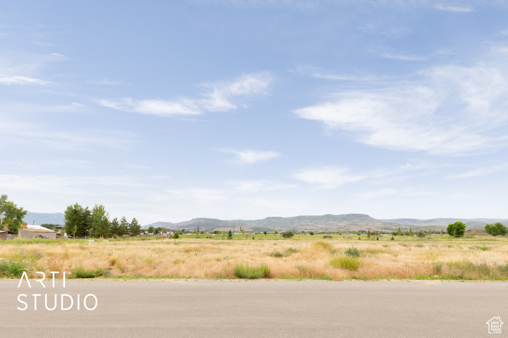 View of mountain backdrop featuring rural landscape