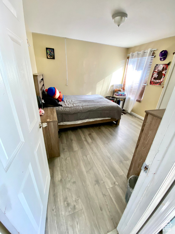 Bedroom with light wood-type flooring