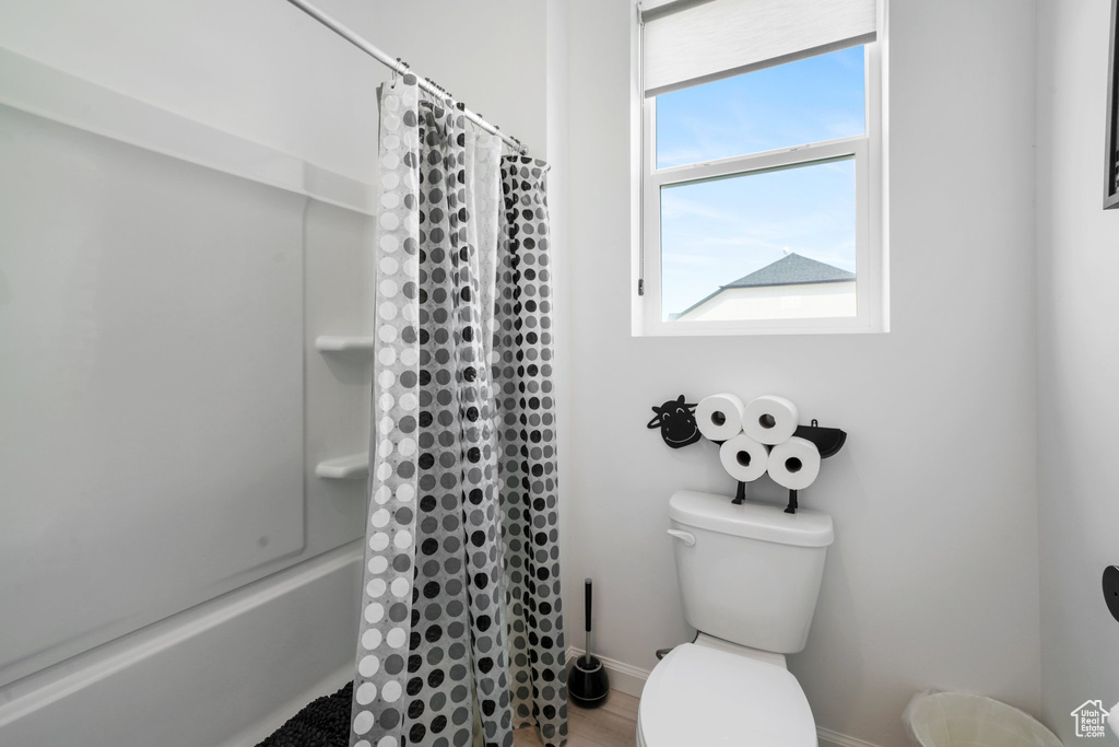 Bathroom featuring toilet and hardwood / wood-style floors