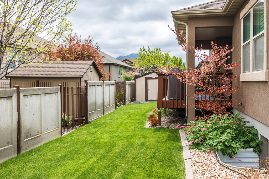 View of yard with a shed and an outdoor structure