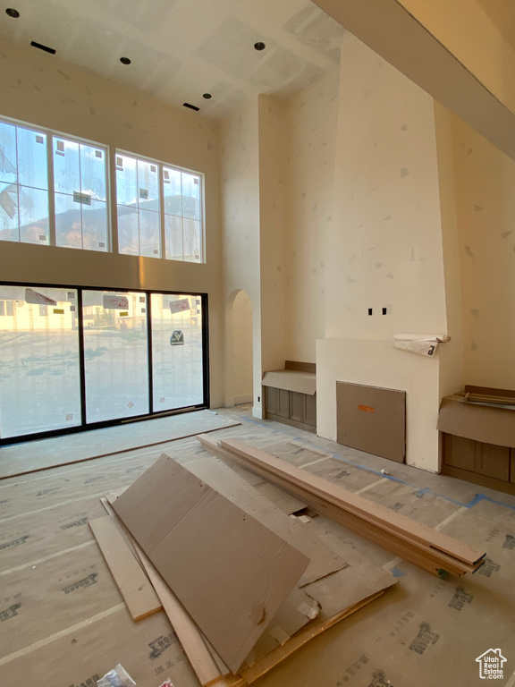 Spare room featuring a towering ceiling