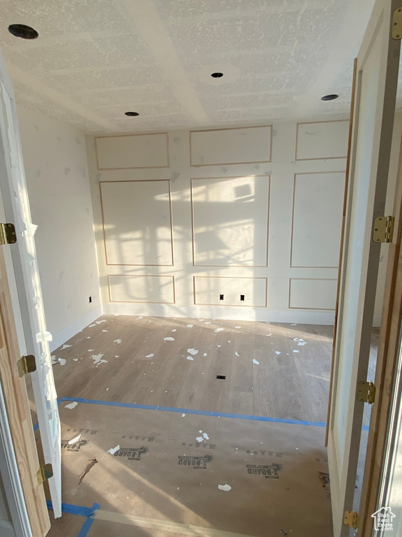 Empty room featuring baseboards
