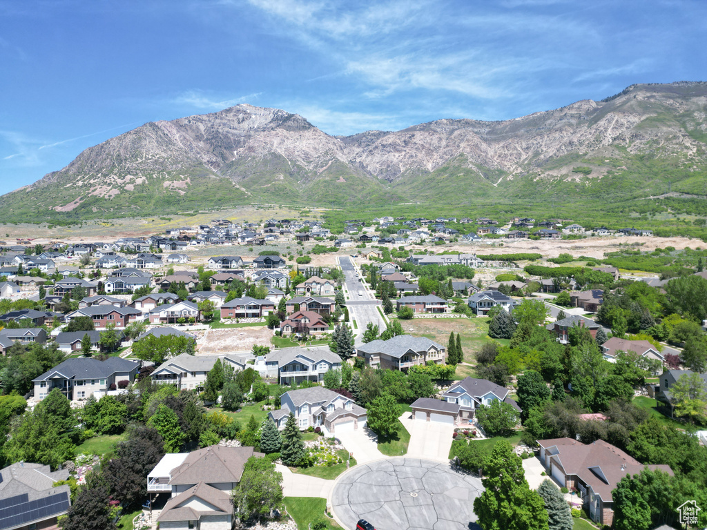 Aerial perspective of suburban area with a mountain backdrop