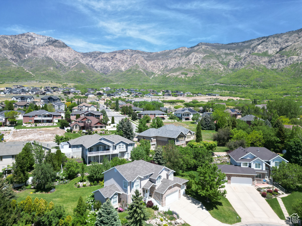 Aerial view of residential area featuring a mountainous background