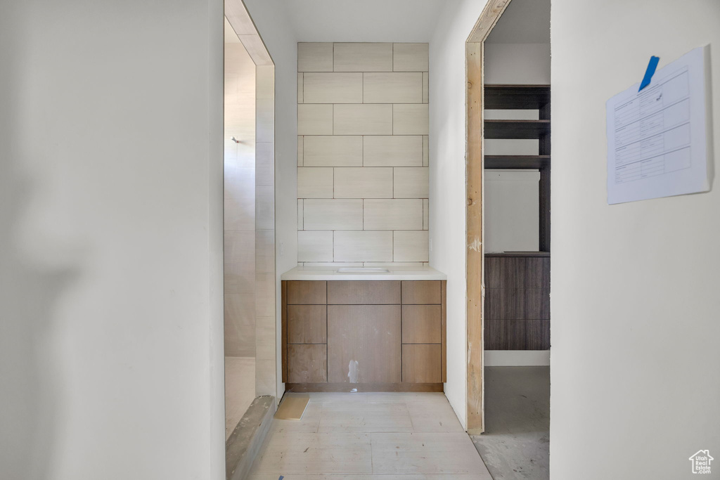 Bathroom featuring tile walls