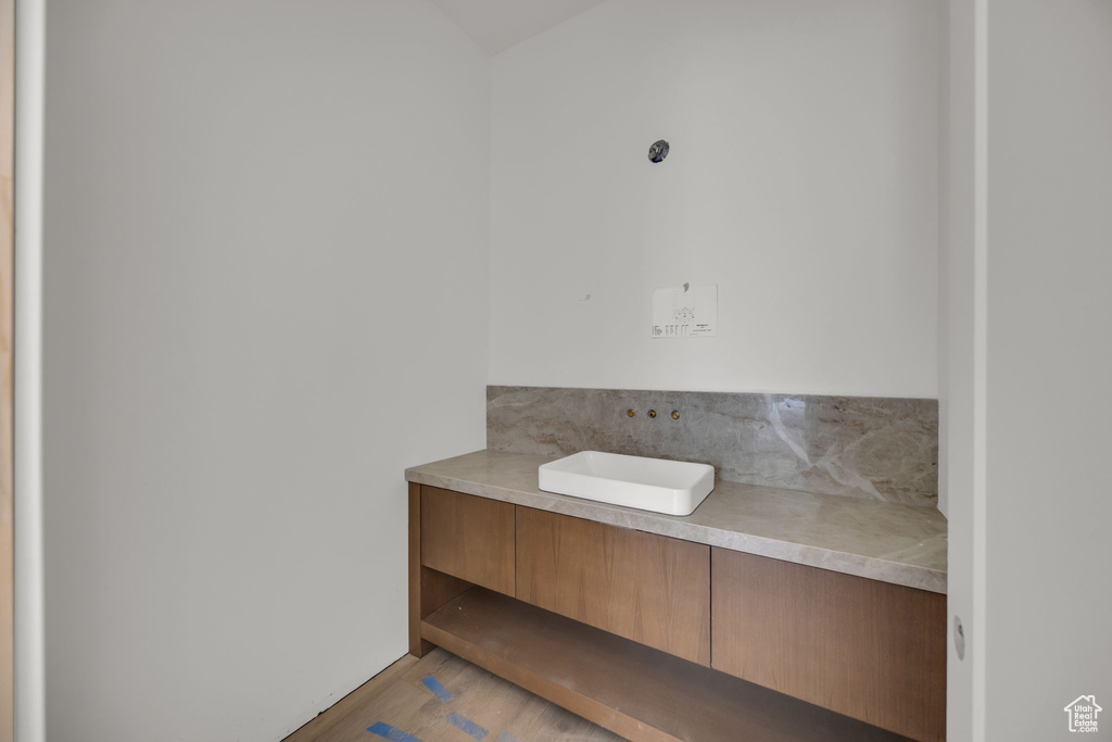 Bathroom featuring wood finished floors and vanity
