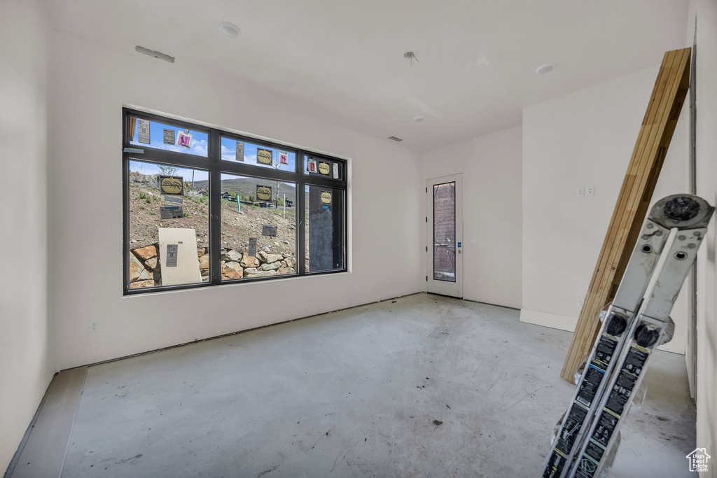 Unfurnished room featuring concrete floors