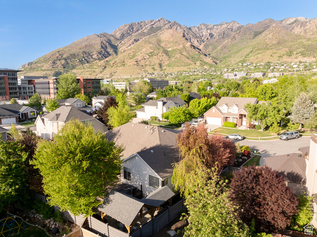 Aerial view of residential area with a mountainous background