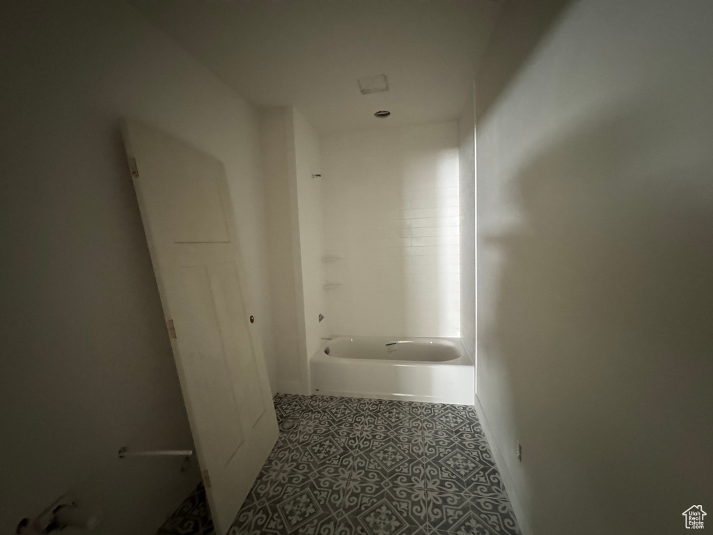 Hall with tile patterned floors