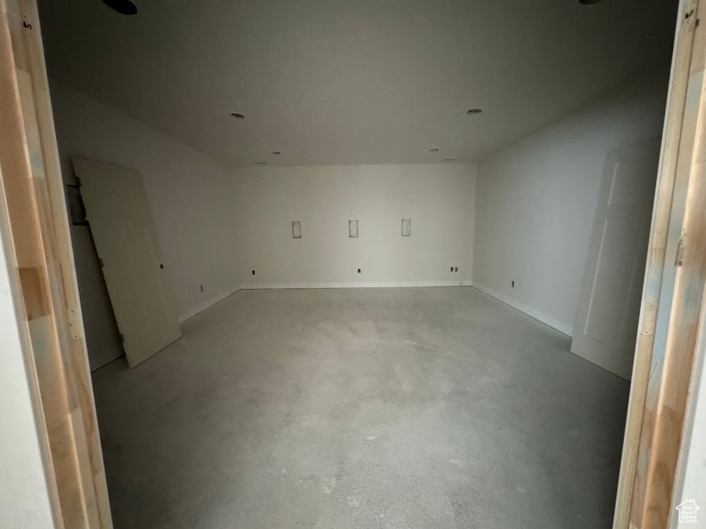 Unfurnished room featuring concrete floors