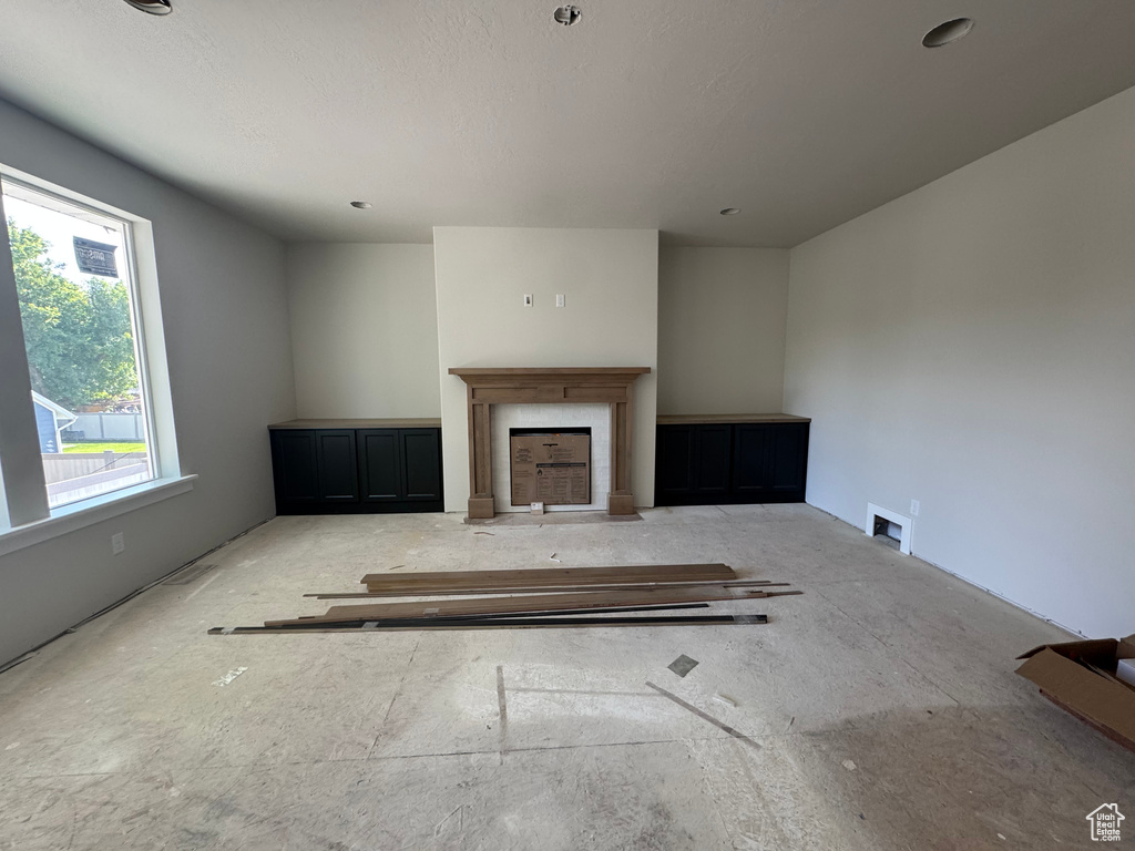Unfurnished living room with a fireplace