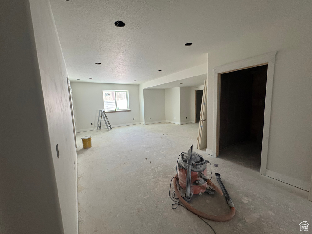 Empty room with a textured ceiling