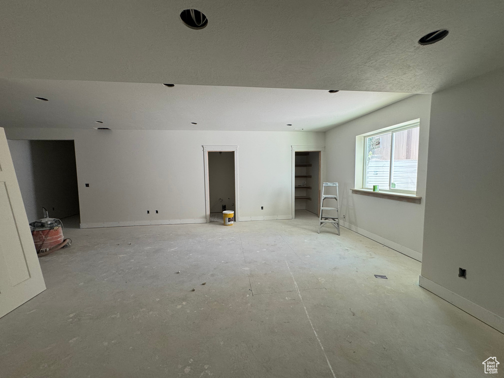 Empty room featuring baseboards