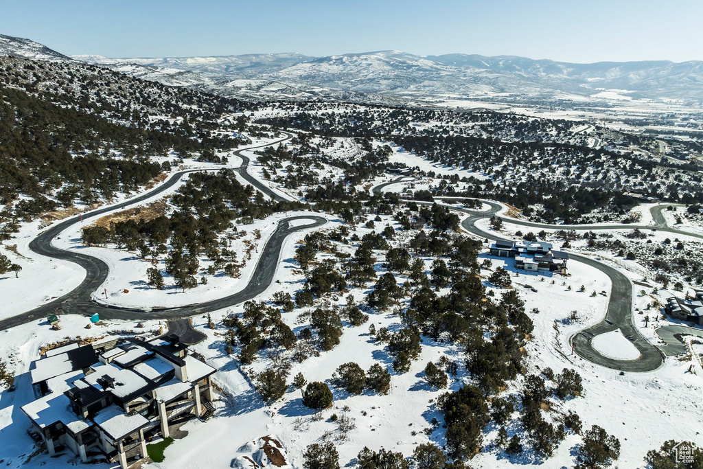 Snowy aerial view with a mountain view