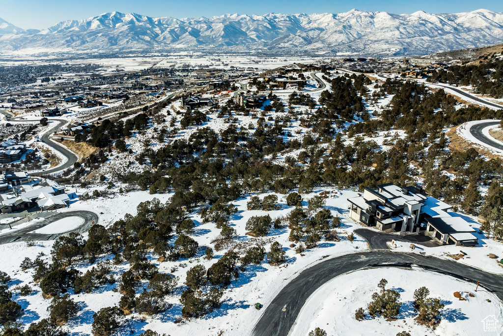 Snowy aerial view featuring a mountain view