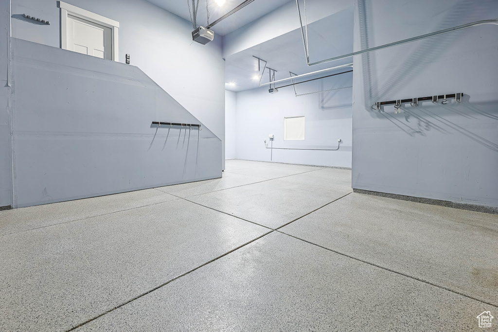 Garage featuring a garage door opener