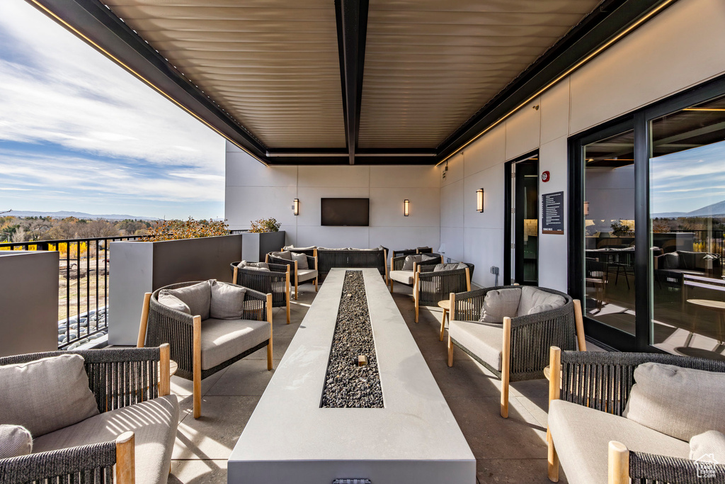 View of patio featuring an outdoor hangout area and a mountain view