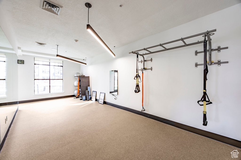 Garage featuring baseboards