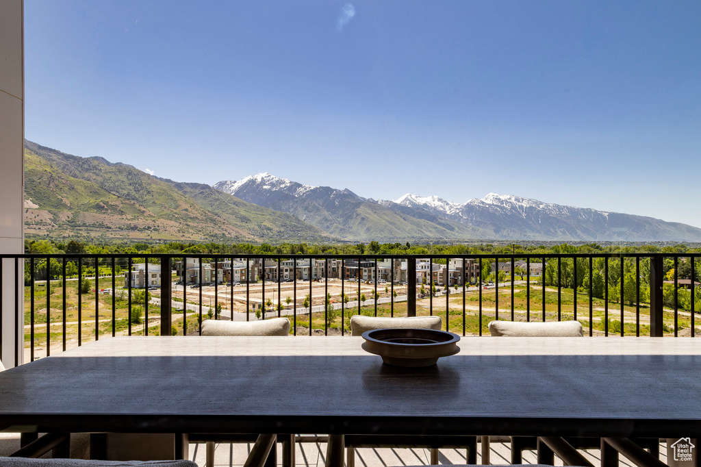 View of patio featuring a mountain view and a balcony