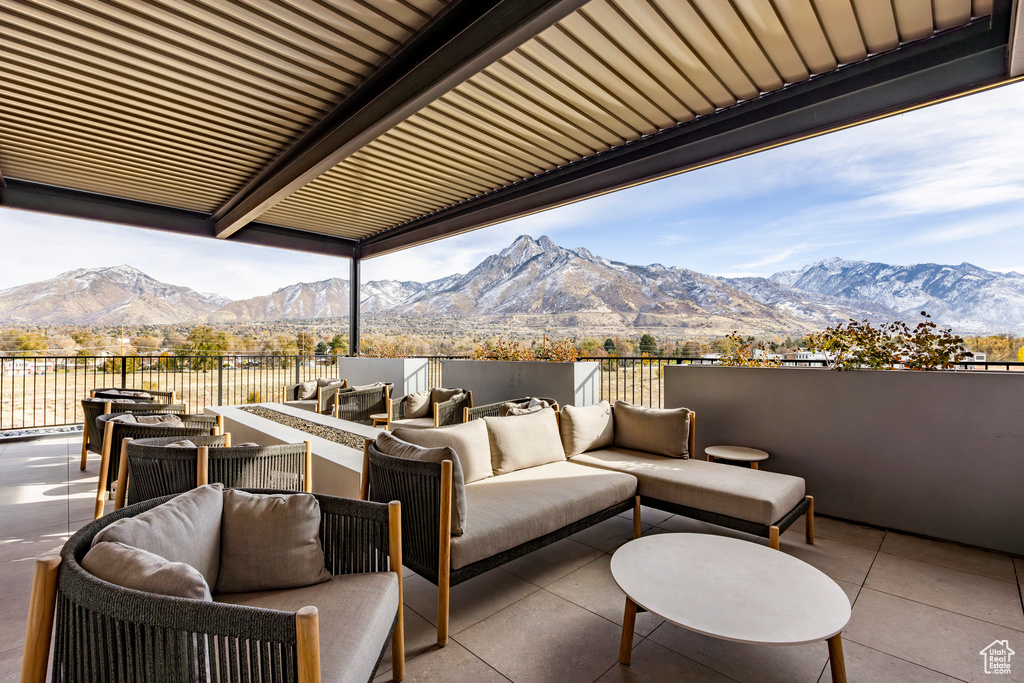 View of patio with outdoor lounge area and a mountain view