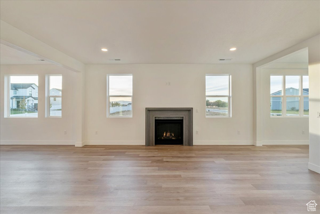 Unfurnished living room with light hardwood / wood-style flooring