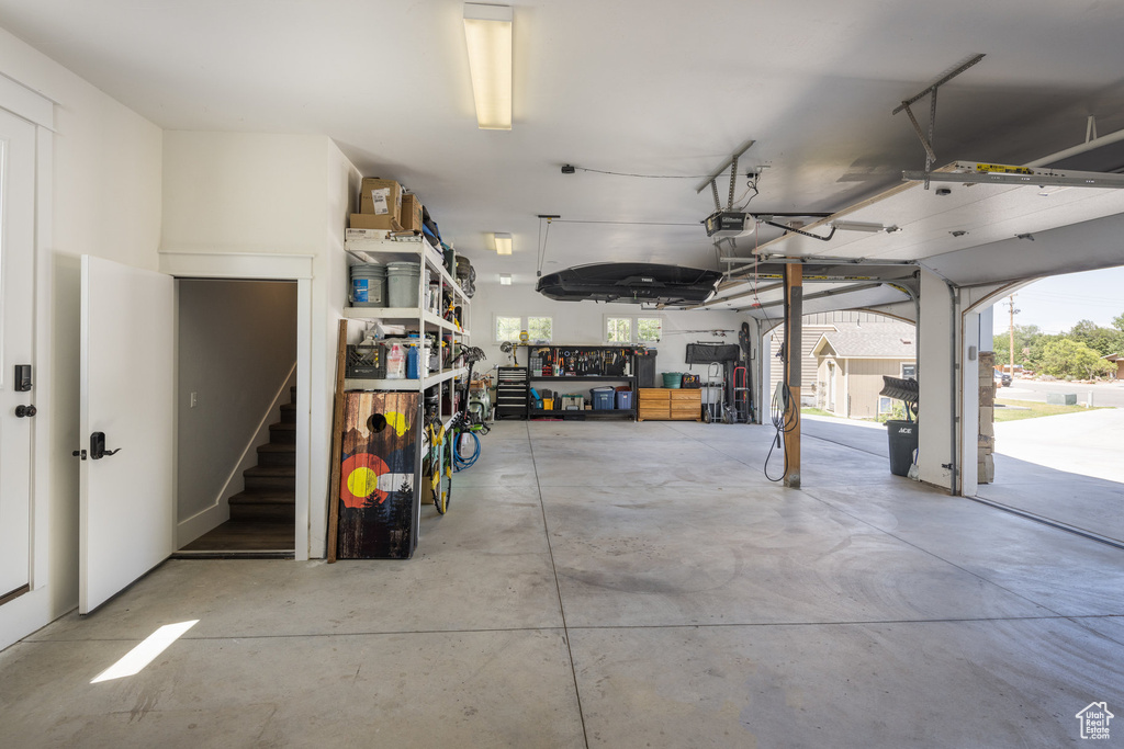 Garage featuring a garage door opener