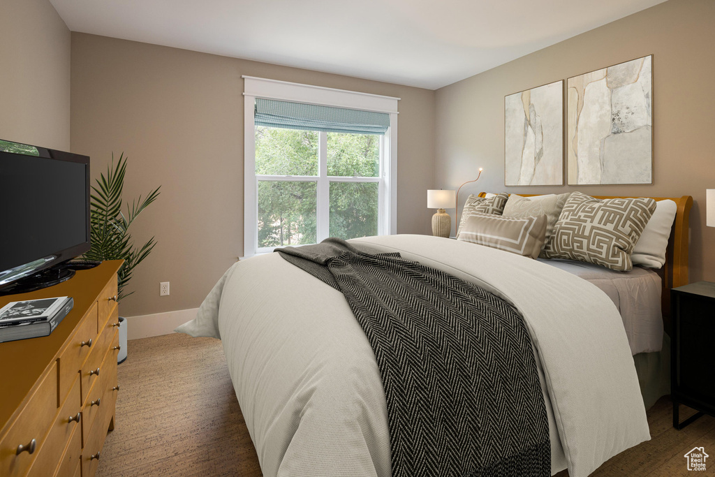 Bedroom featuring baseboards