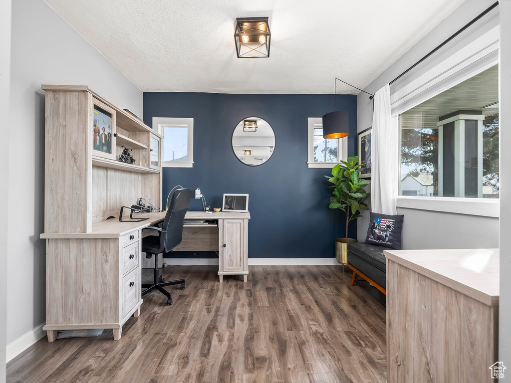 Office space featuring dark hardwood / wood-style floors