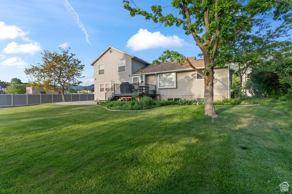 Back of house featuring a deck
