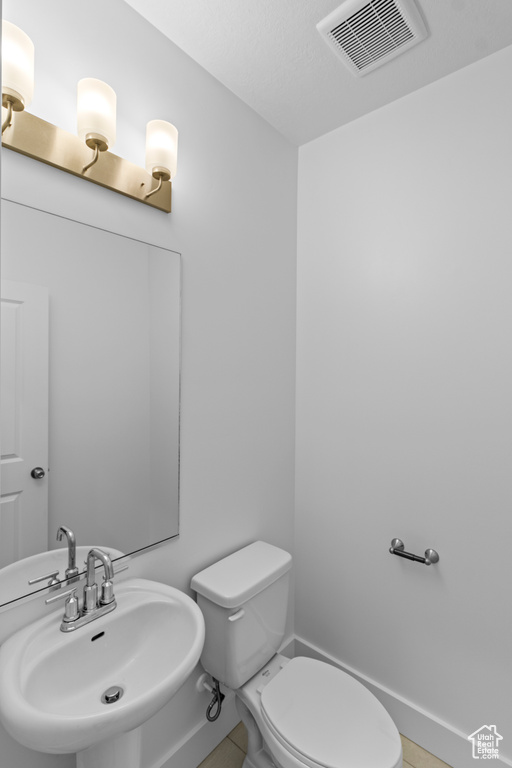 Bathroom with sink and toilet