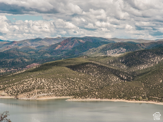 Mountain view featuring a water view