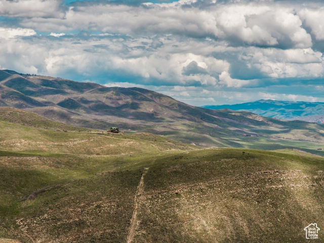 Property view of mountains with a rural view