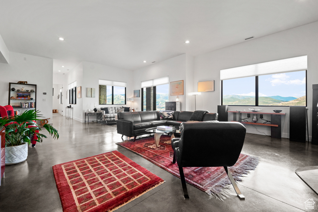 Living room with plenty of natural light and a mountain view