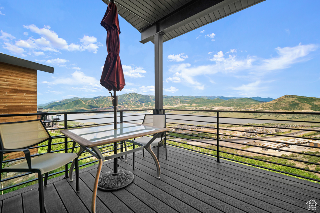 Wooden terrace featuring a mountain view