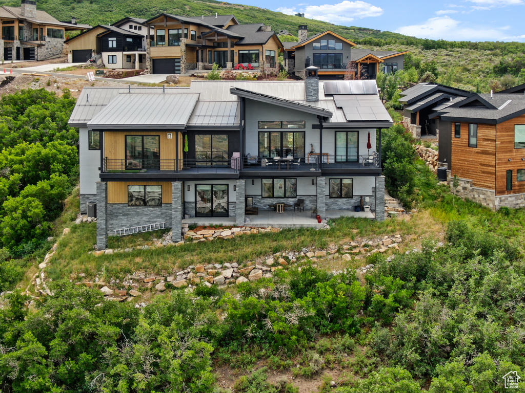 Back of property with a patio