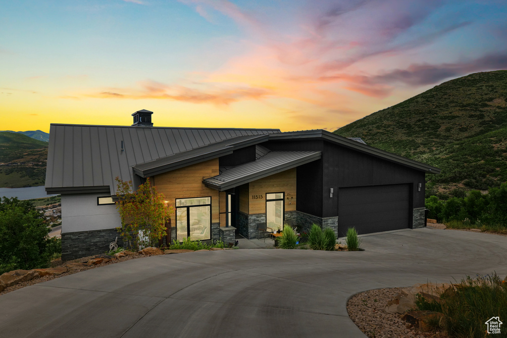 Contemporary house with a mountain view and a garage