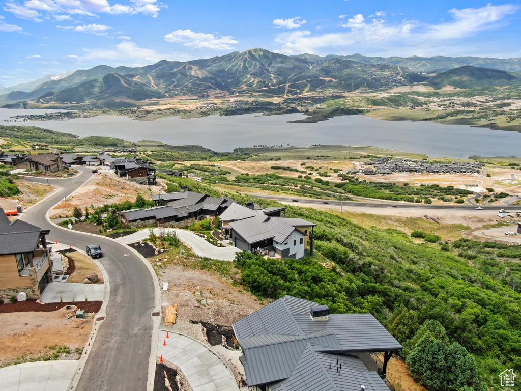 Aerial view featuring a water and mountain view