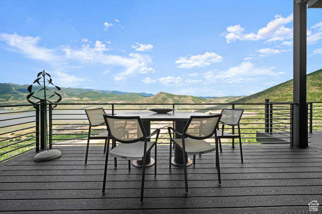 Wooden terrace featuring a mountain view