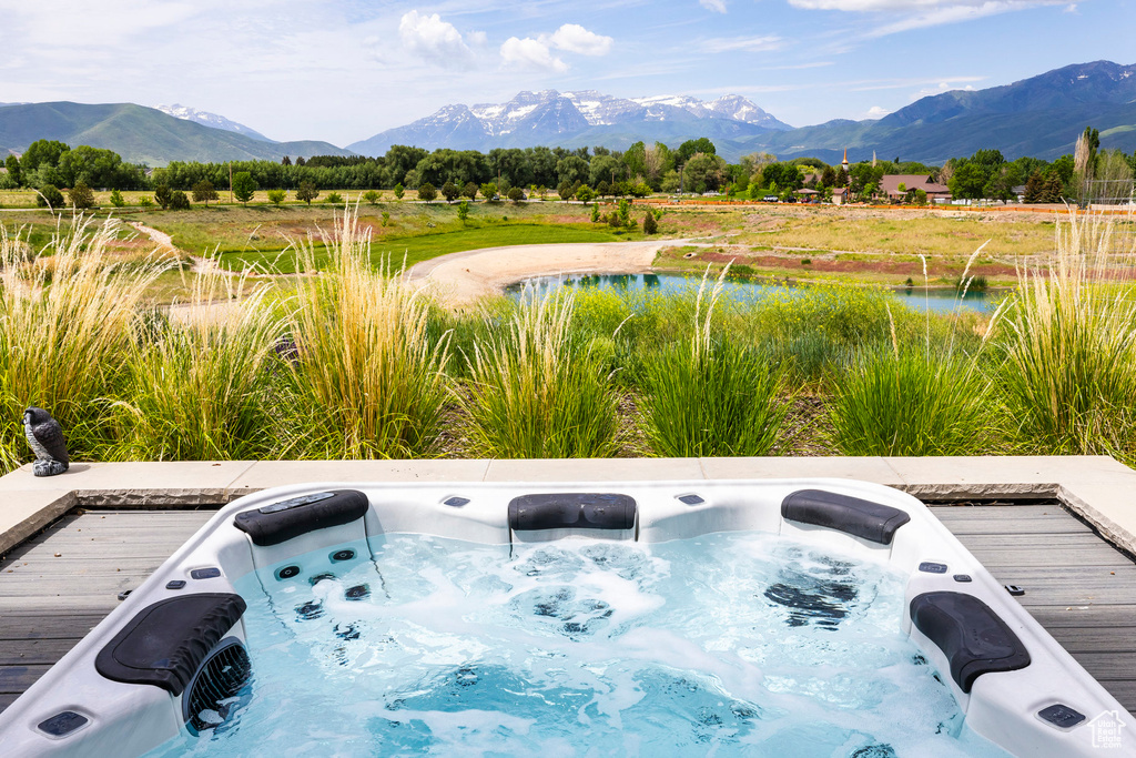 View of mountain backdrop featuring a nearby body of water