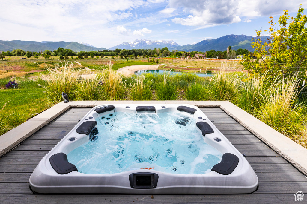 View of swimming pool featuring a water and mountain view