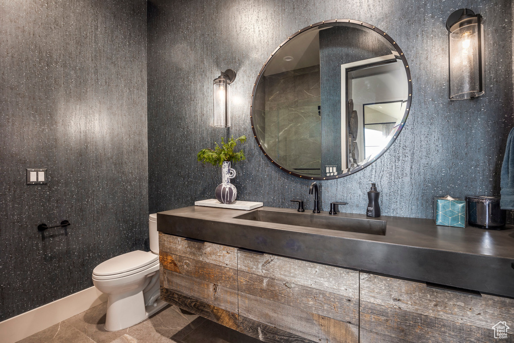 Bathroom featuring toilet and vanity