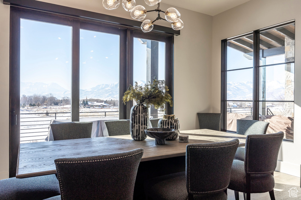 Dining room with a chandelier and a mountain view