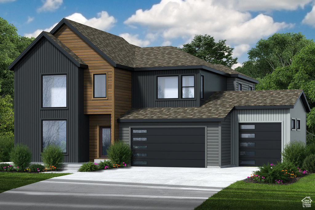 View of front facade featuring a garage