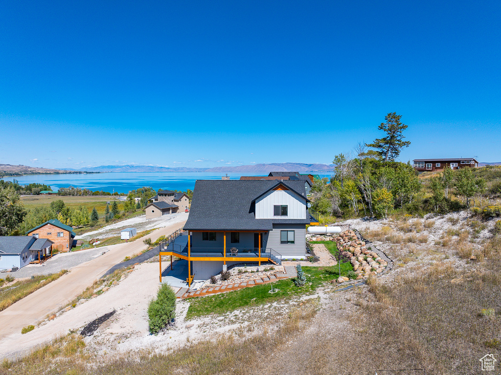 View of front facade featuring a water and mountain view