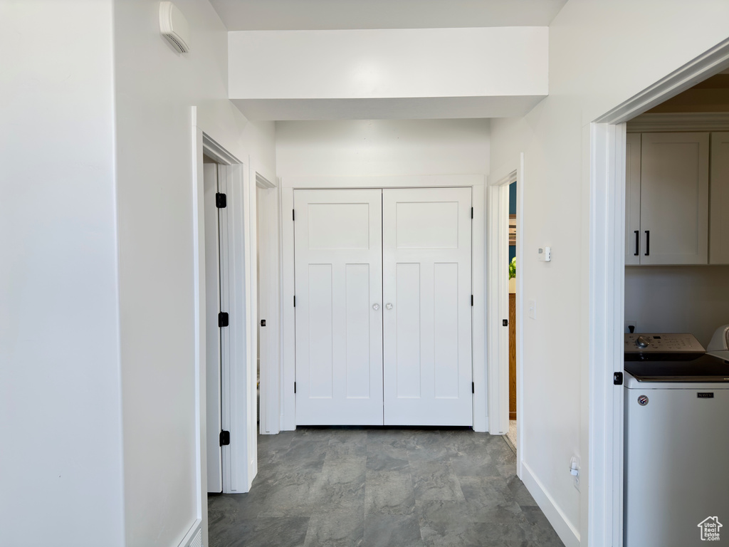 Hallway with washing machine and dryer