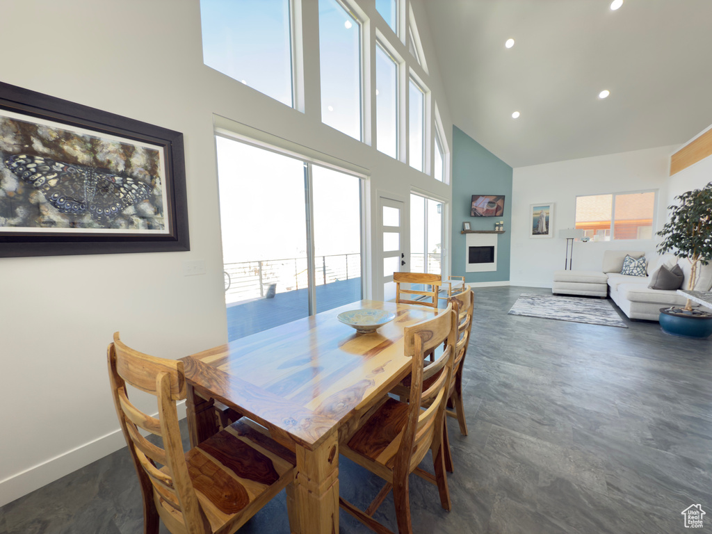 Dining space featuring a towering ceiling