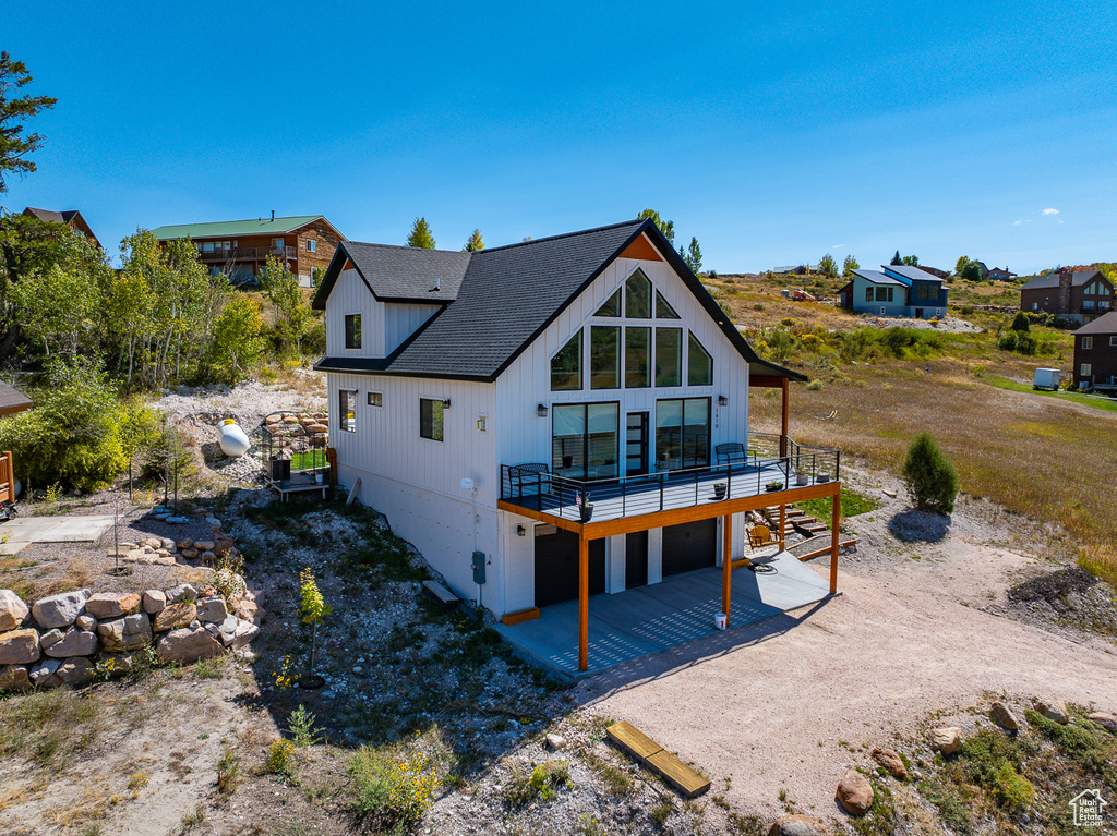 Rear view of house featuring a deck