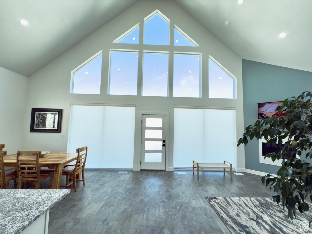 Interior space featuring high vaulted ceiling