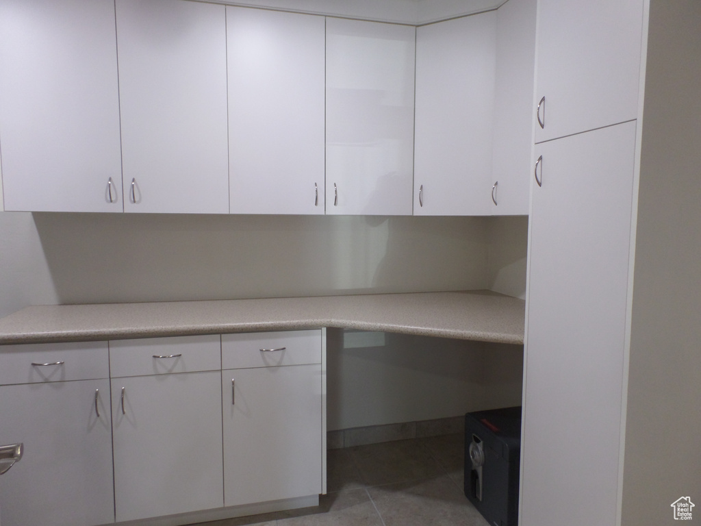 Interior space with light tile patterned flooring